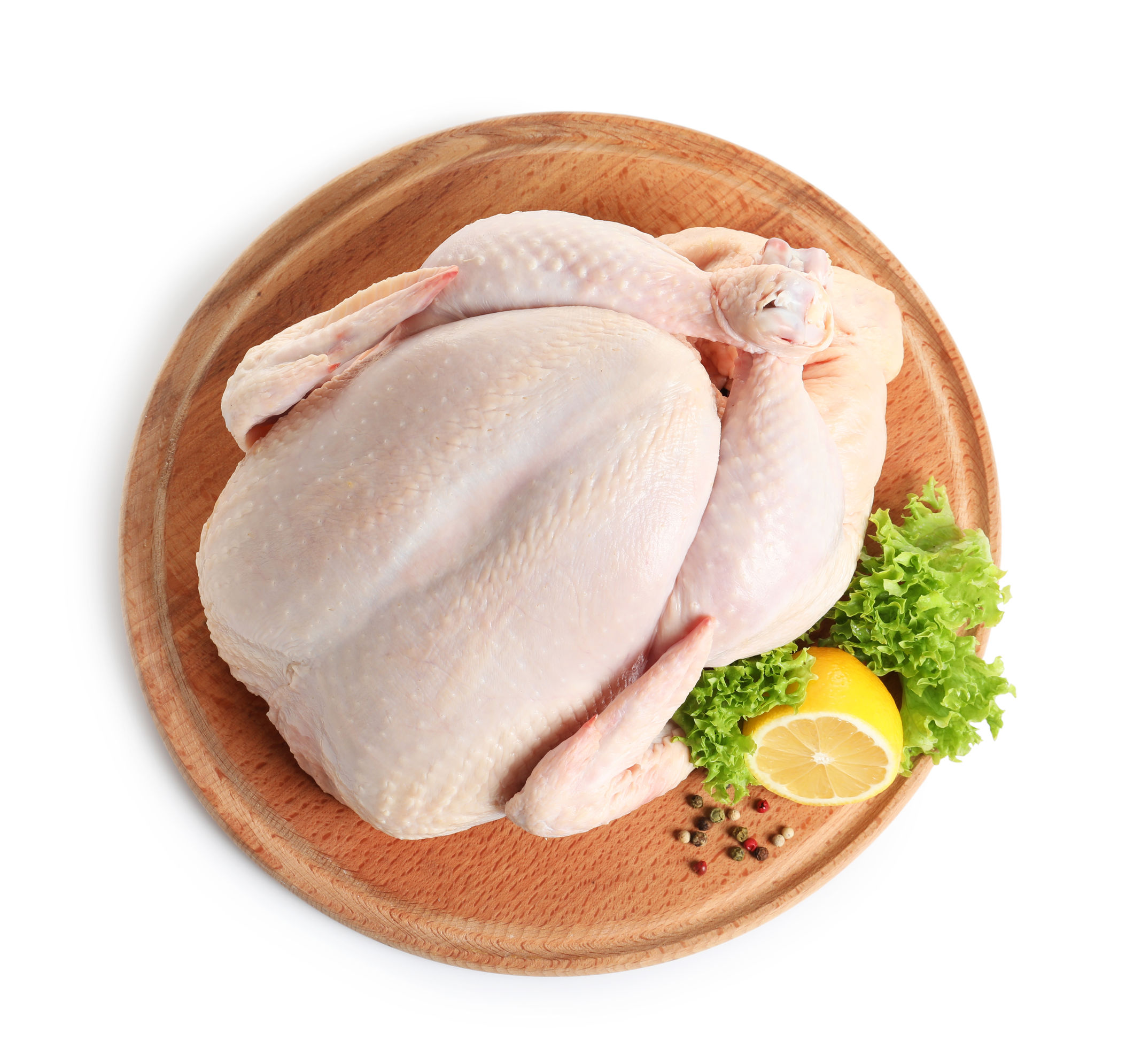 Wooden board with raw turkey and ingredients on white background, top view Wooden board with raw turkey and ingredients on white background, top view